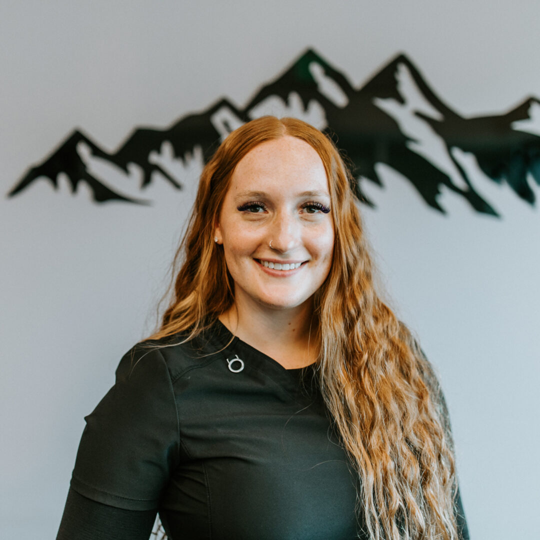 A close up photo of a woman who is smiling