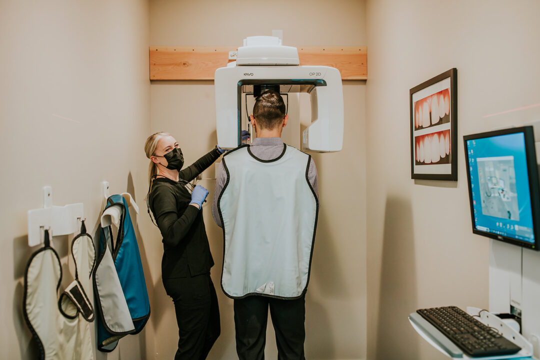 A photo of a dental patient being treated in a dentist room