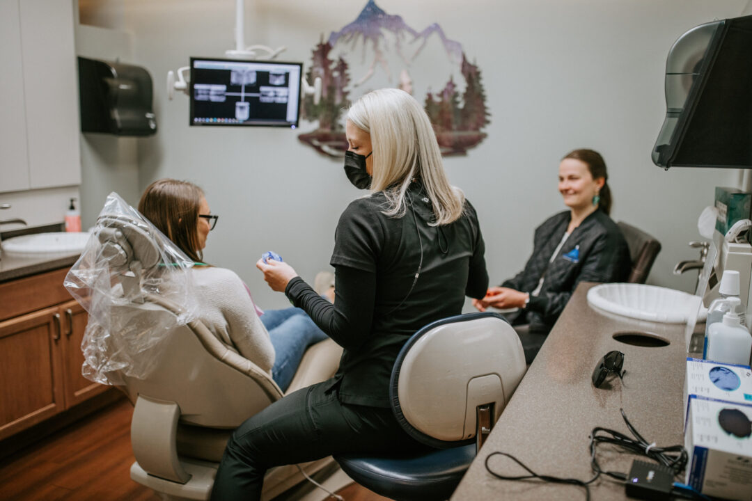 A photo of a dental patient being treated in a dentist room