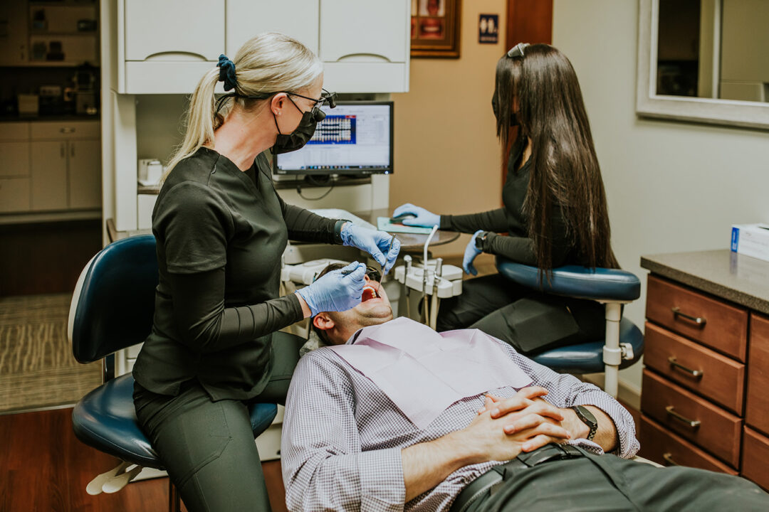 A photo of a dental patient being treated in a dentist room