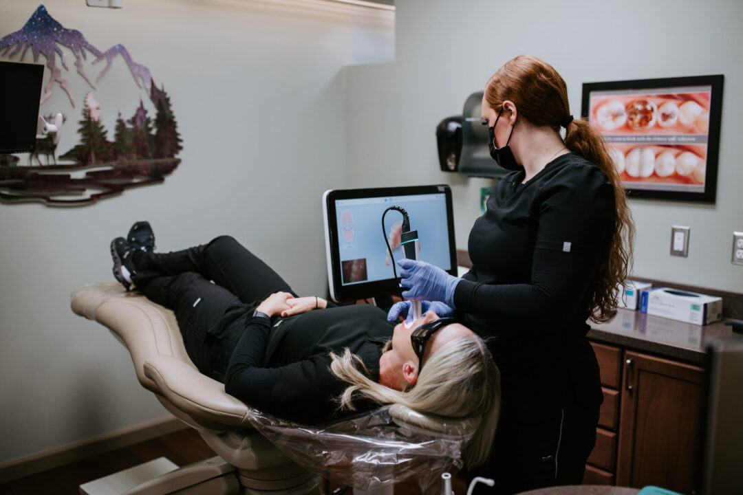A photo of a dental patient being treated in a dentist room