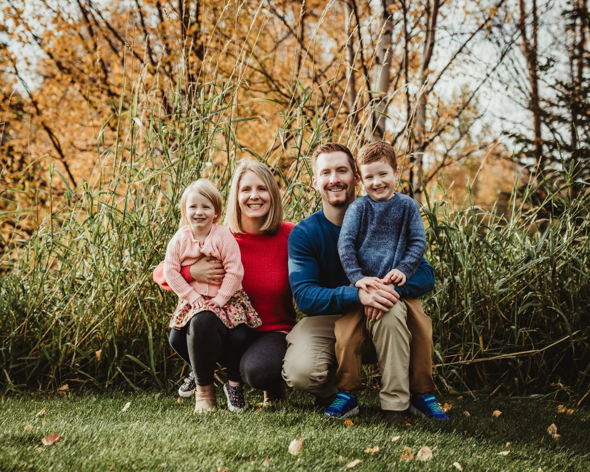 A group photo of five people in a dentist office